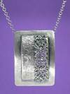 Framed filigree pendant